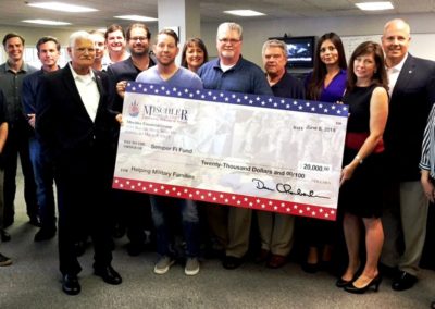 Team Mischler Presents Memorial Day Month Pledge check for $20k to Semper Fi Fund’s Wendy Lethin
